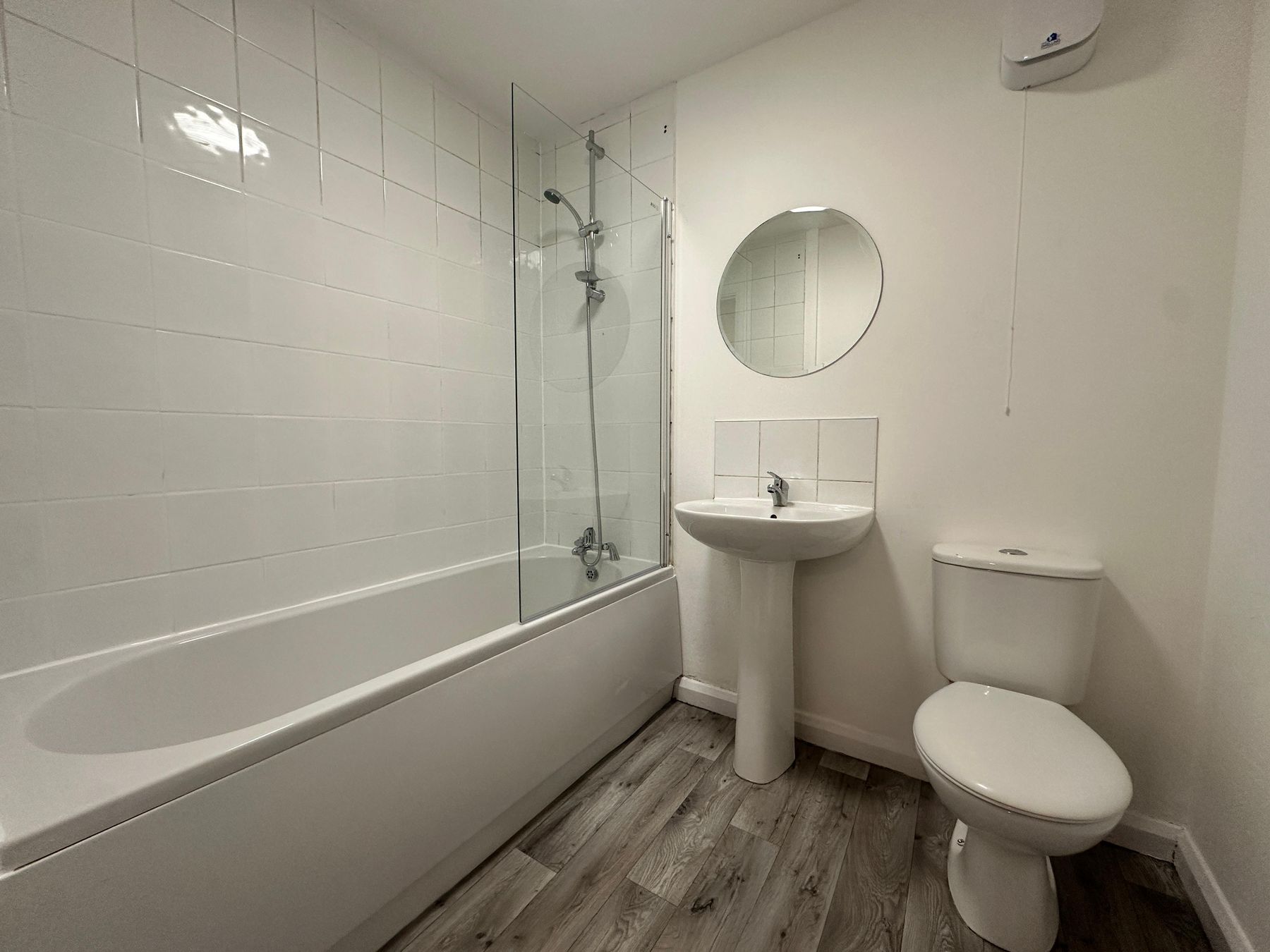 Bathroom with bath, shower and glass screen